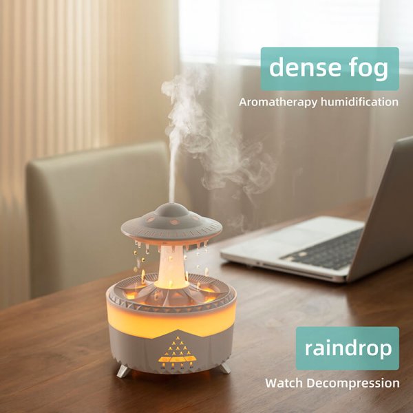 Warm light aromatherapy machine that sprays thick mist to simulate raindrops